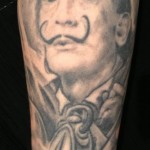 inkin - tatouage dali visage sur bras - atelier 23 tattoo.jpg