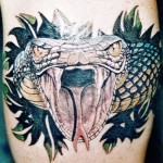 inKin-tatouage-serpent-bras-FLO TATOUAGE.jpg