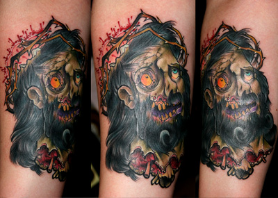 inkin - tatouage jésus zombie sur bras